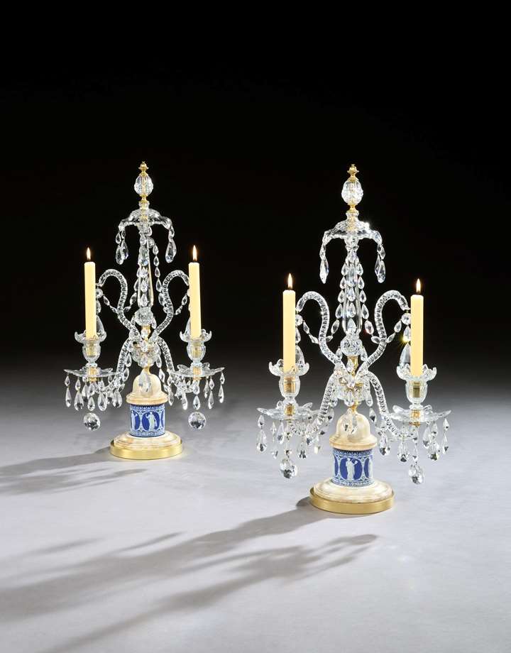 A pair of George III cut glass candelabra